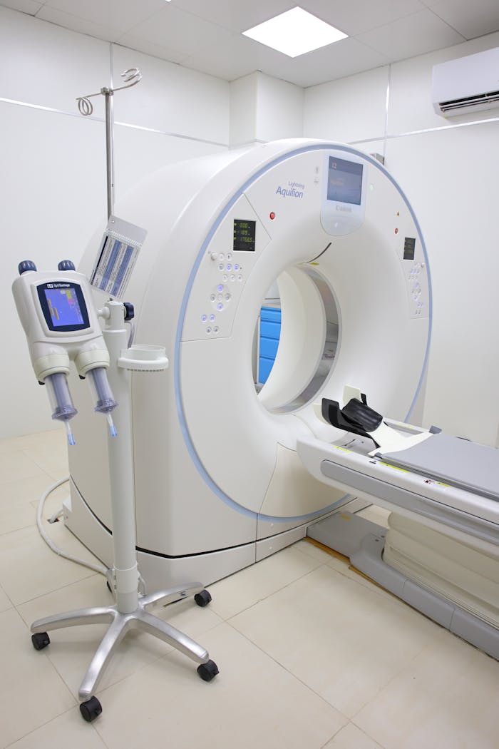 Offerings Bright hospital room featuring a modern MRI machine and related technology.